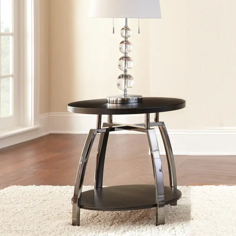 Elegant Cocktail Table with Casters: Soft Round Top, Black Nickel Base