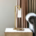 26" Brass Metal Arched Table Lamp With Clear Seeded Cylinder Shade - Minihomy