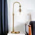 27" Brass Metal Arched Table Lamp With Clear Seeded Dome Shade - Minihomy